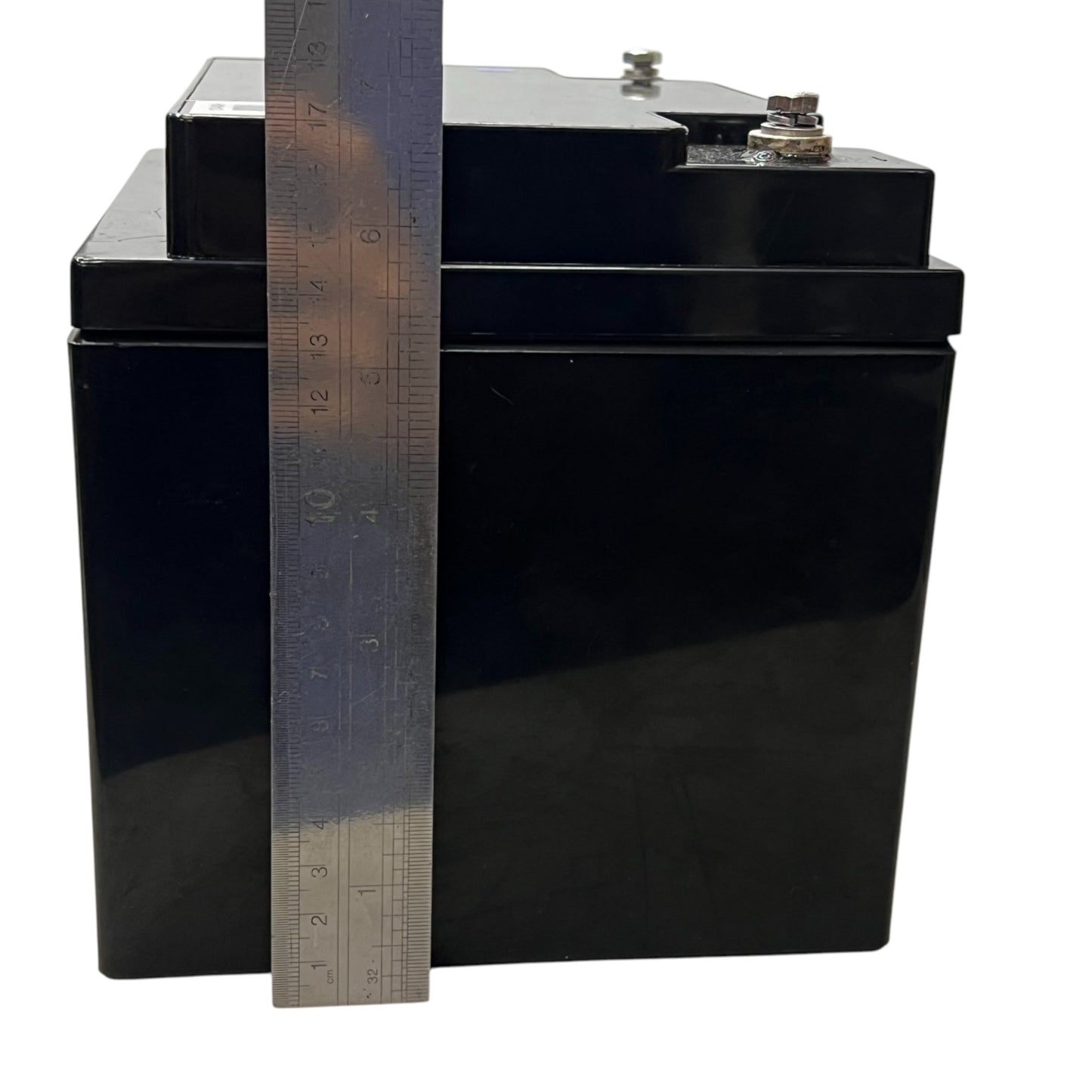 Black sealed 12V 40Ah Lead Acid Battery with top terminals shown next to ruler for size reference