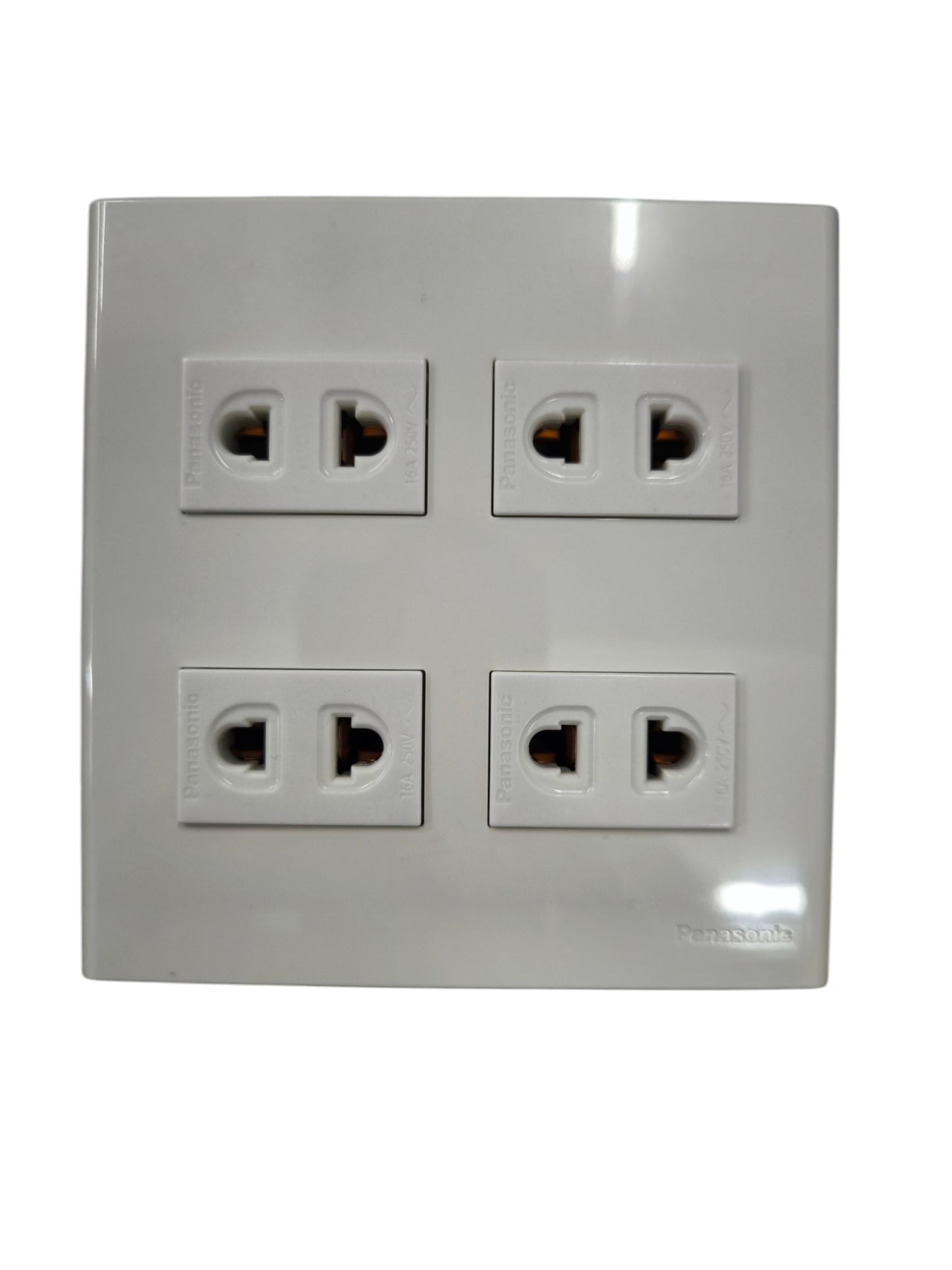 Panasonic 4 gang universal outlet with four universal power sockets in a white plastic frame