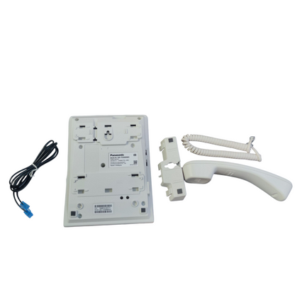Parts of a white Panasonic desk phone including handset base, handset, coiled cord, and RJ11 cable