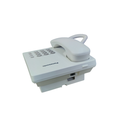 White Panasonic desk phone with numeric keypad and handset resting on base for office use