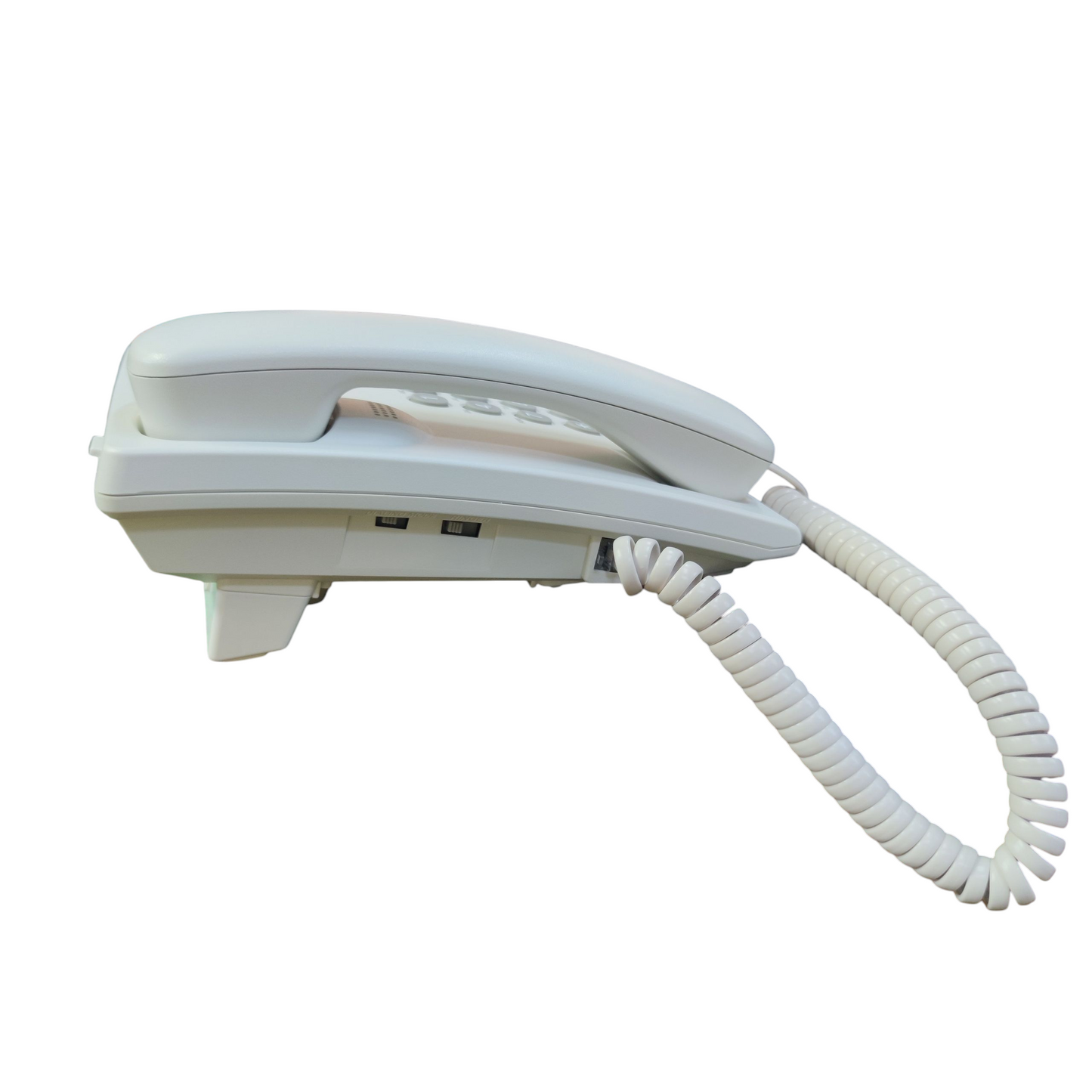 White Panasonic desk phone with handset and coiled cord for office and home use