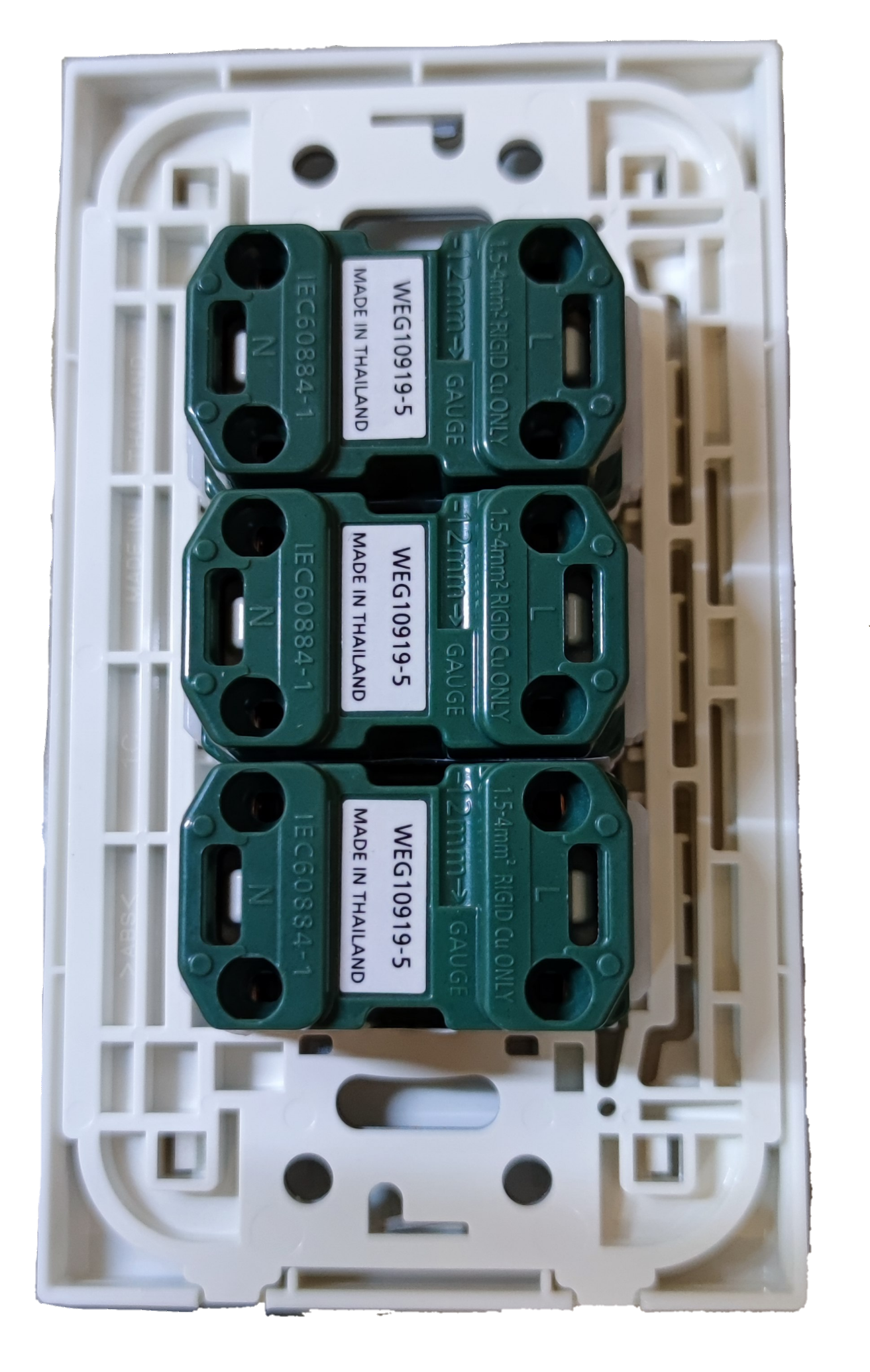 Panasonic 3 gang universal outlet internal modules with white mounting plate and green connectors