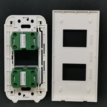 Panasonic WEG1001-5 WEG6802 outlet components with two green sockets in a white wall plate