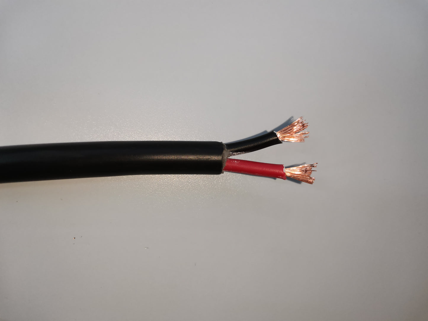 Close-up of Phelps Dodge perma cord wire with black and red insulated copper leads