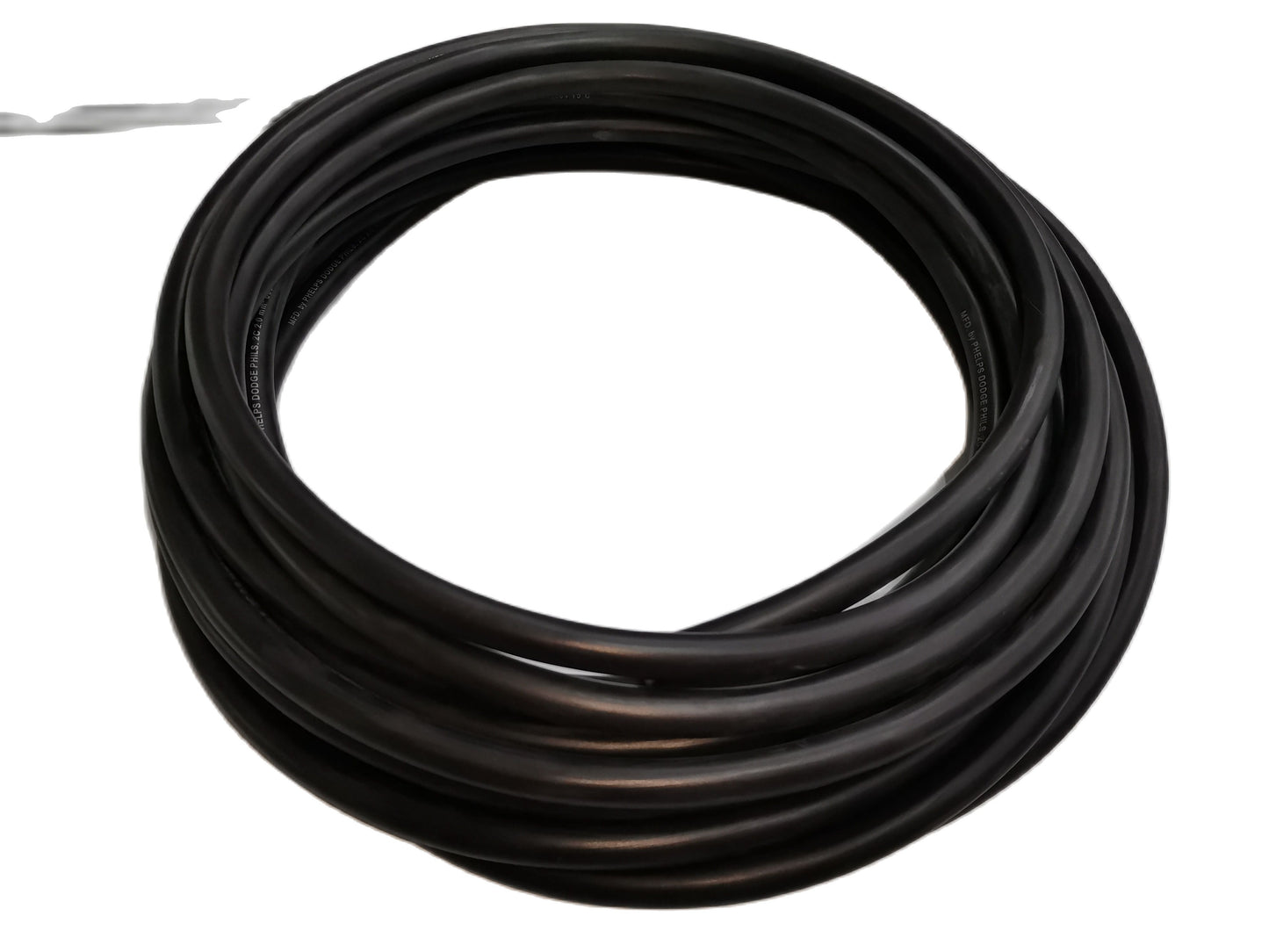Coiled black Phelps Dodge perma cord wire durable insulated electrical wire