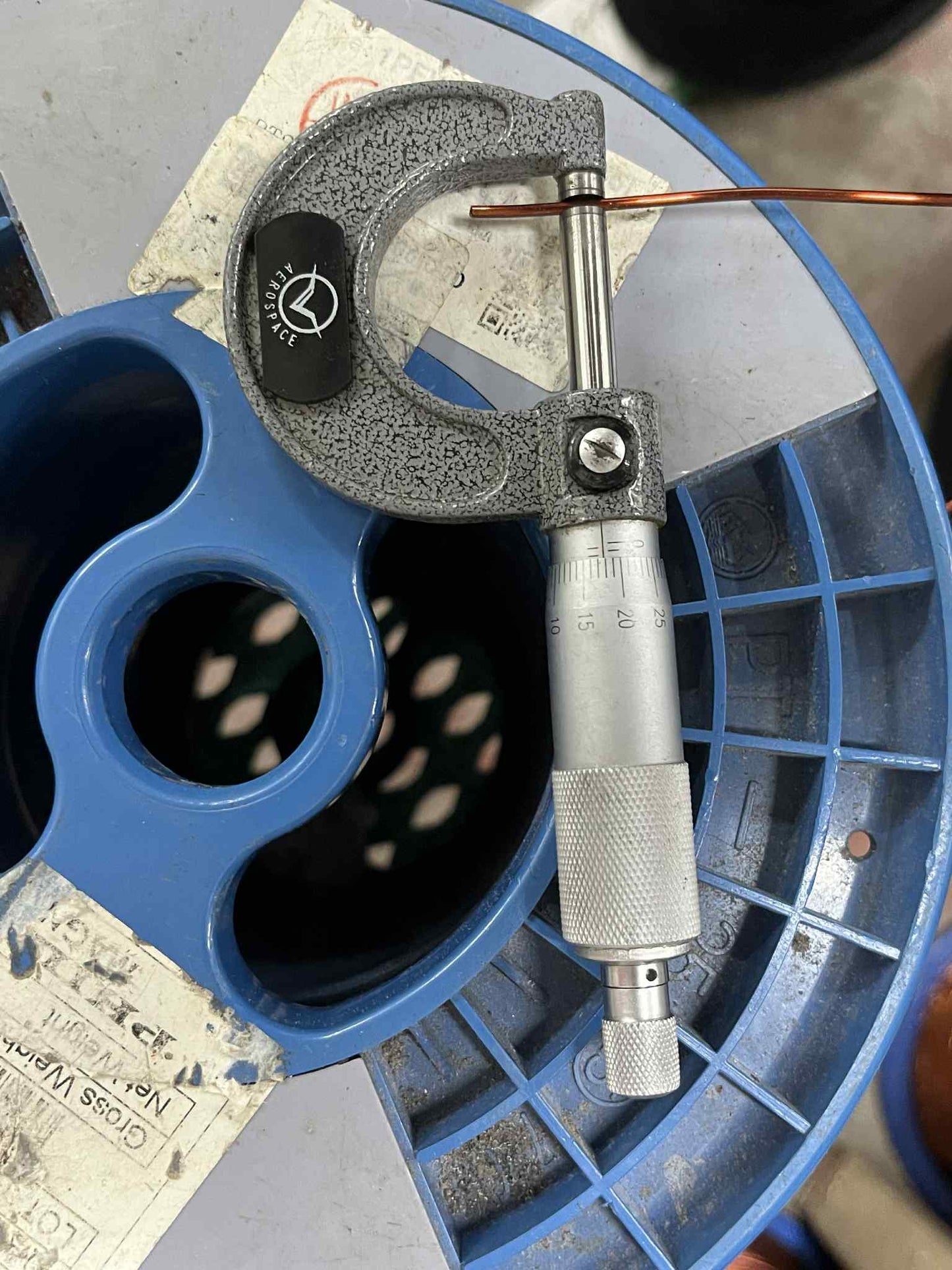 Philflex magnet wire AWG 14 900G being measured with a micrometer on a blue spool