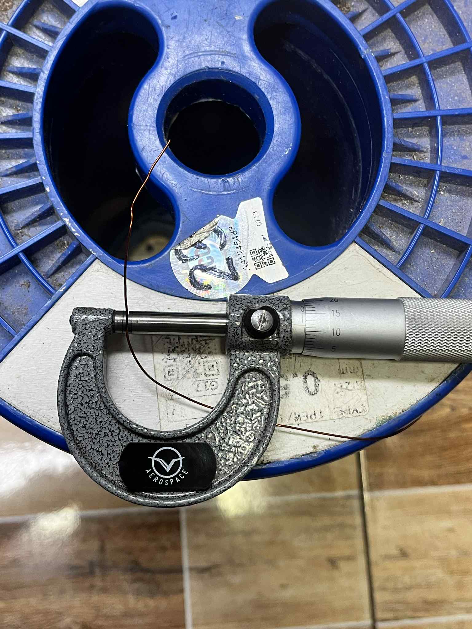 Philflex magnet wire AWG 23 1 KG measured with a micrometer on a blue spool