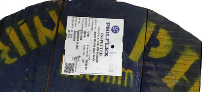 Wooden spool reel with Philflex 30mm welding cable product label on industrial painted drum