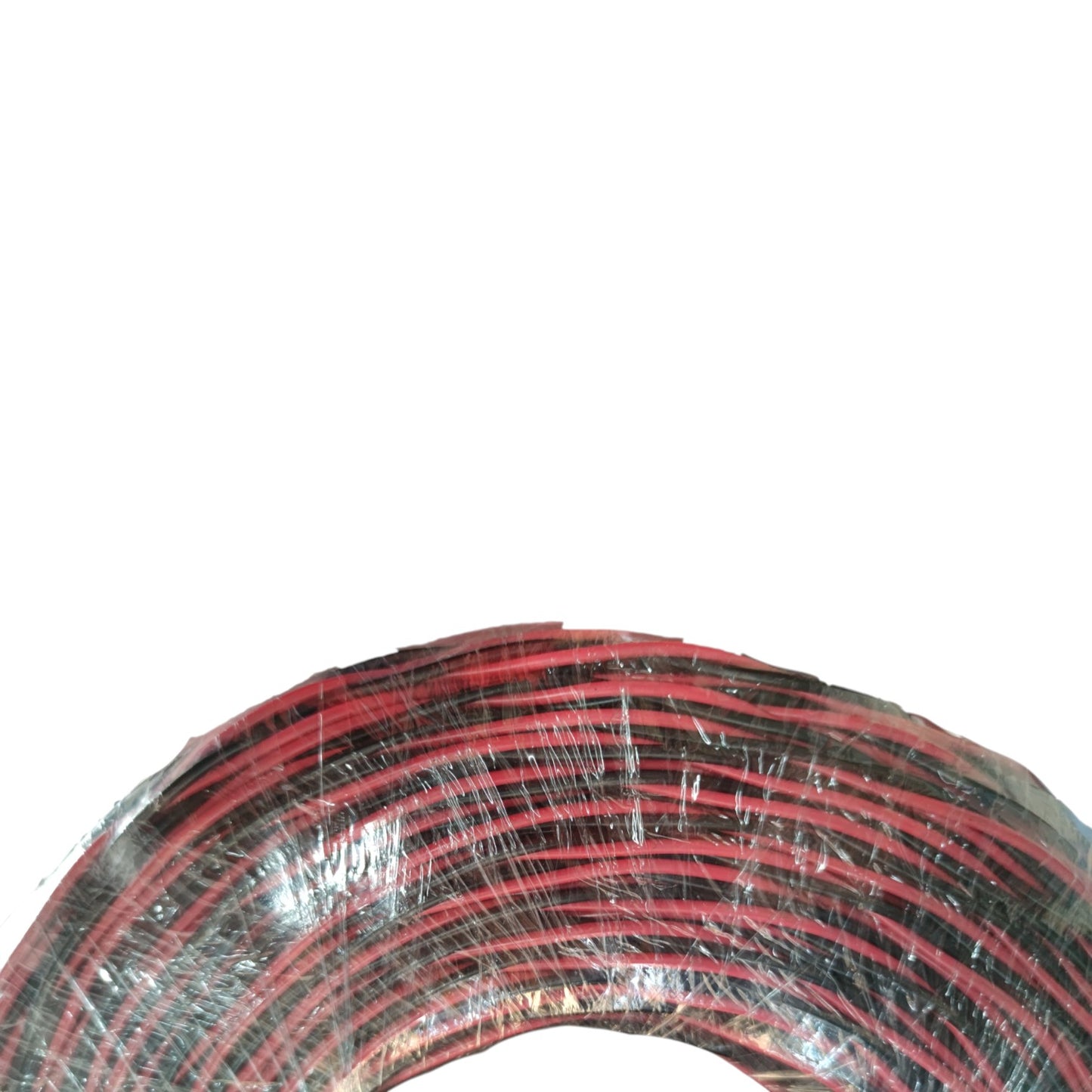 Coiled red and black cable on a white background