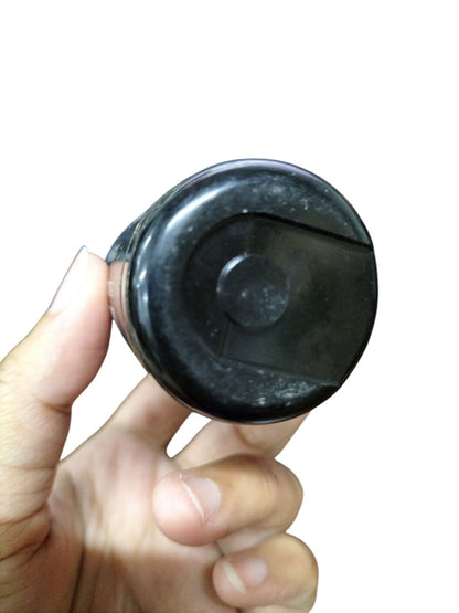 Philips motor starting capacitor 130-156UF in a compact black casing held in hand