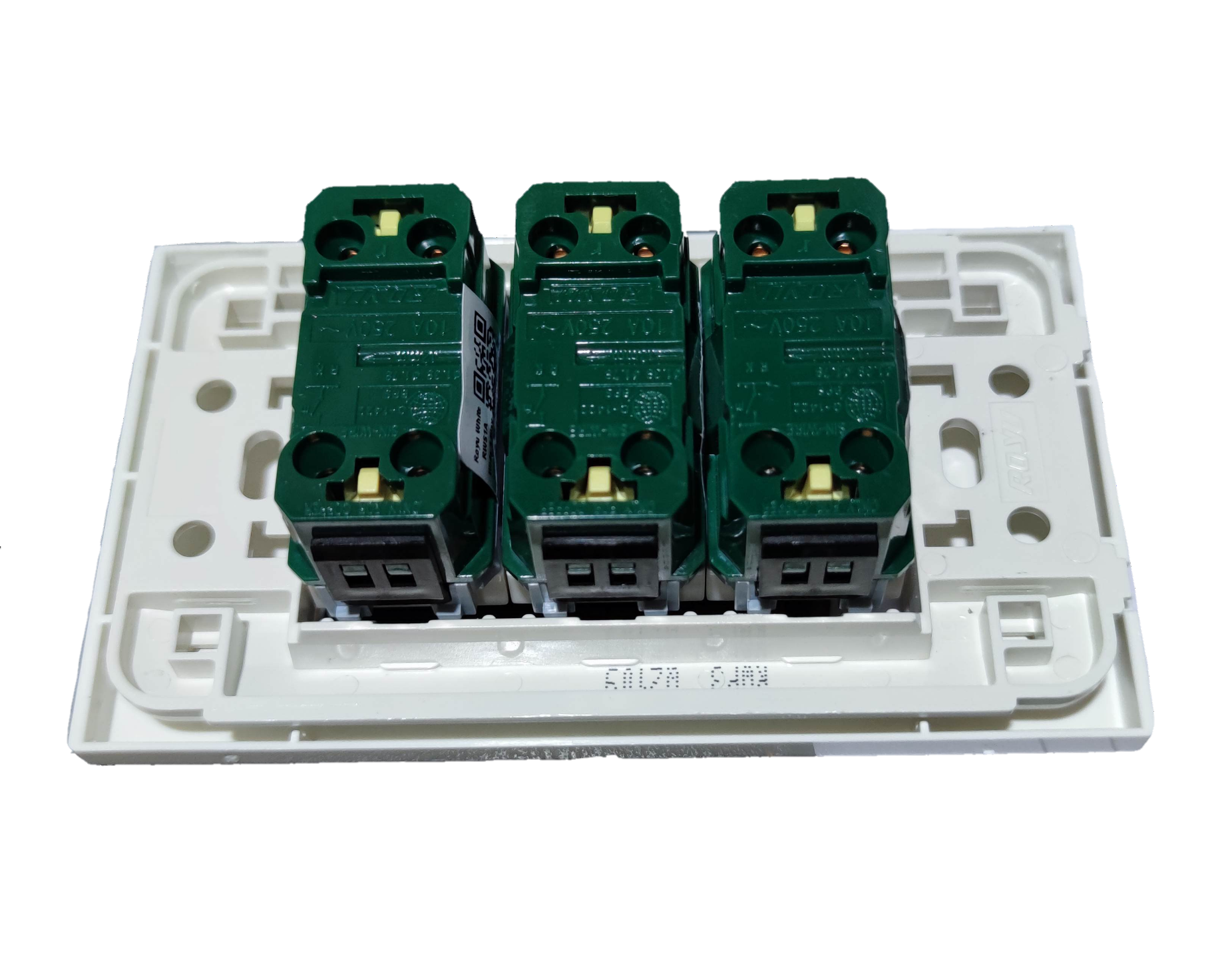 Royu 3 gang switch wall plate showing three green switches attached to white base