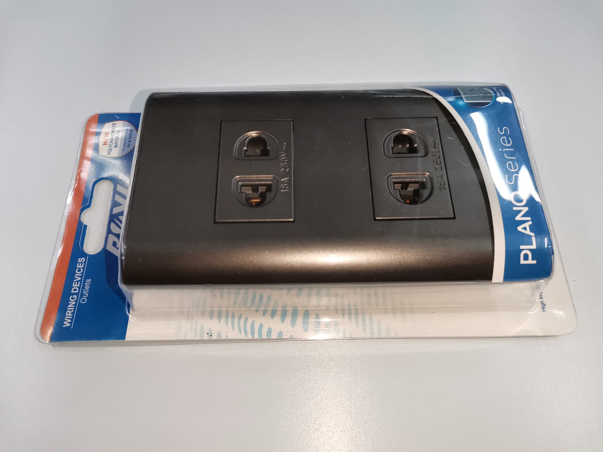 Royu dark gray plano series outlet power points with four plug sockets in retail packaging