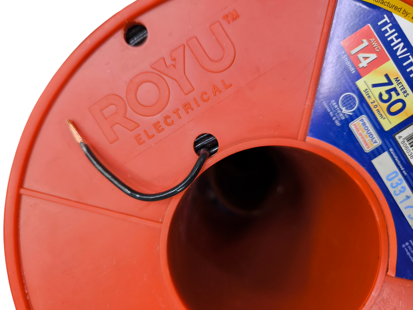 Royu THHN THWN wire black partially unspooled from red Royu Electrical spool