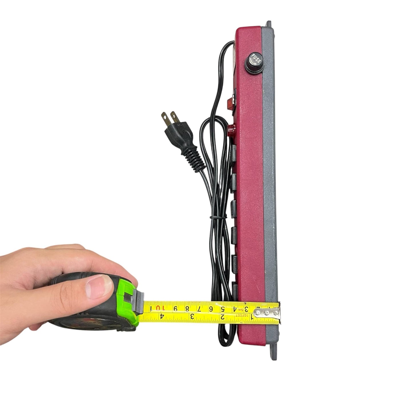 Red 6 gang extension outlet power strip being measured with a tape measure showing its length