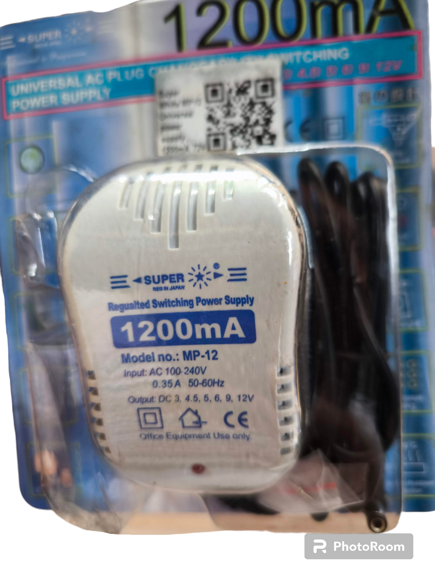 Universal Adaptor 1200mA Output 3V regulated switching power supply with cords in packaging