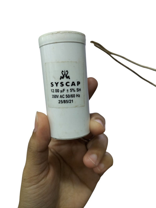 Syscap 12UF Motor Running Capacitor held in hand for electrical circuitry and motor applications