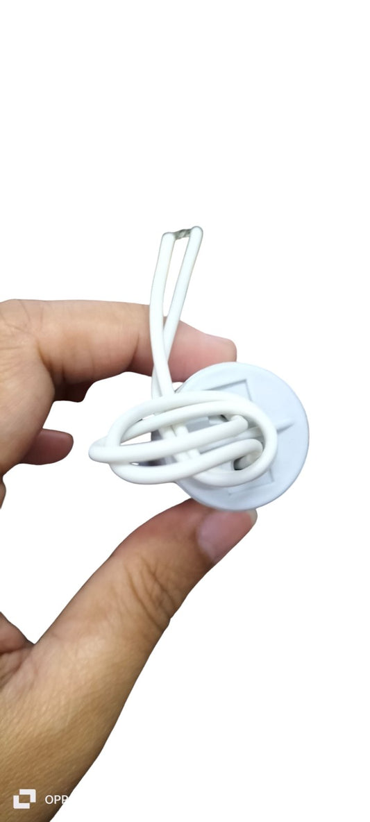 Syscap 1MFD 450V AC Running Capacitor held in hand with white wires attached