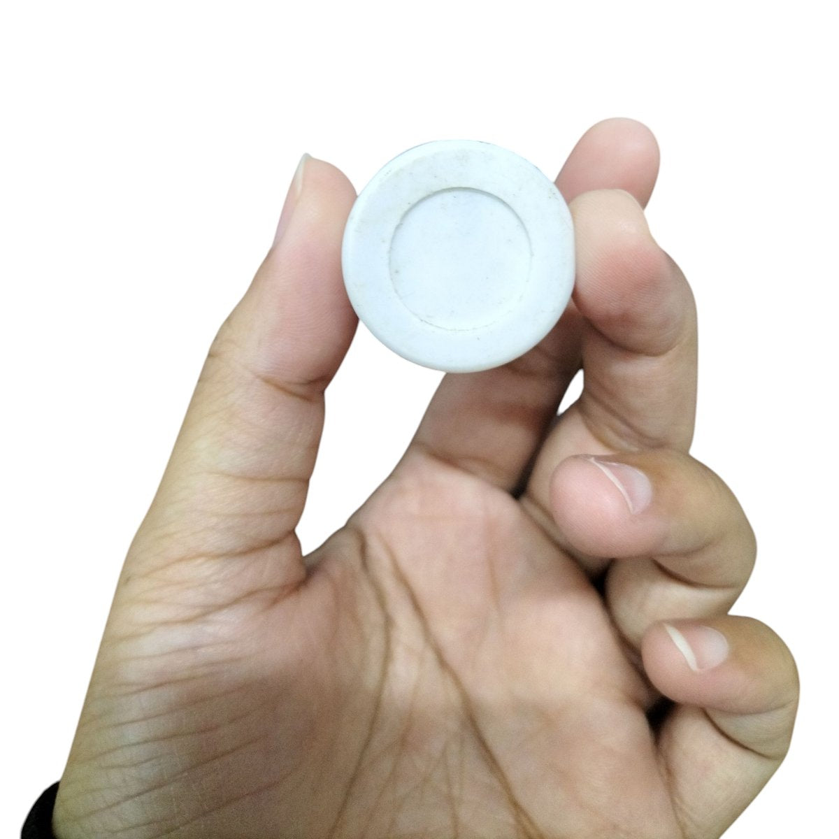 Syscap 250V AC motor start capacitor held in hand, ideal for electrical circuit applications