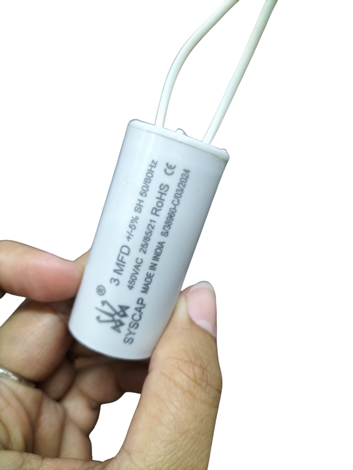 Syscap 3MFD 450V AC Running Capacitor Electrical Circuitry component held in hand