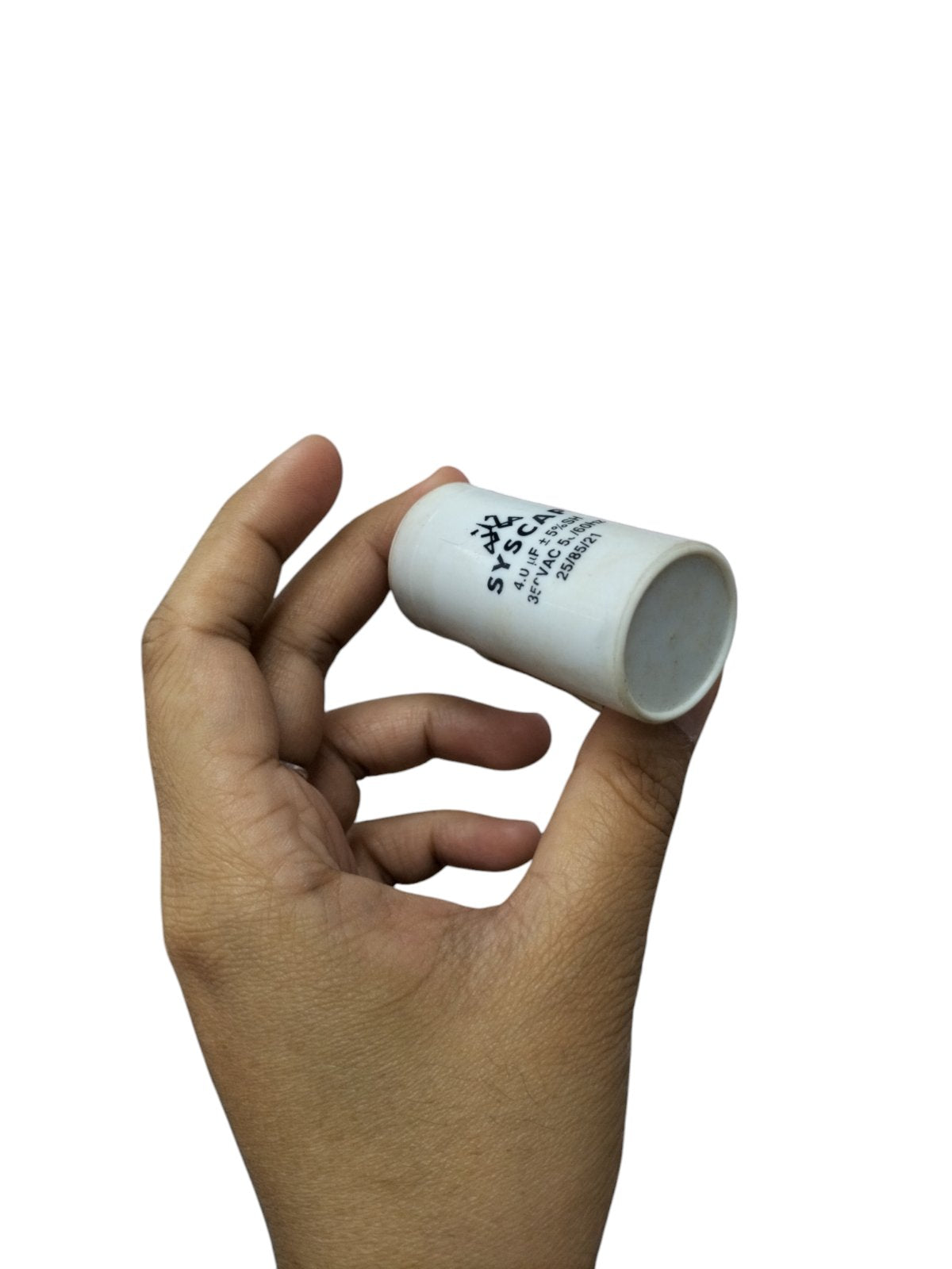 Hand holding Syscap 4MFD Motor Running Capacitor electrical part for motor circuits