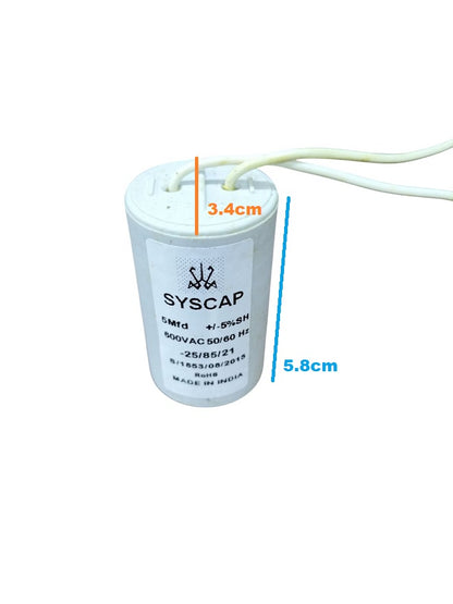 Syscap motor capacitor with white cylindrical body and attached wires for electrical circuitry