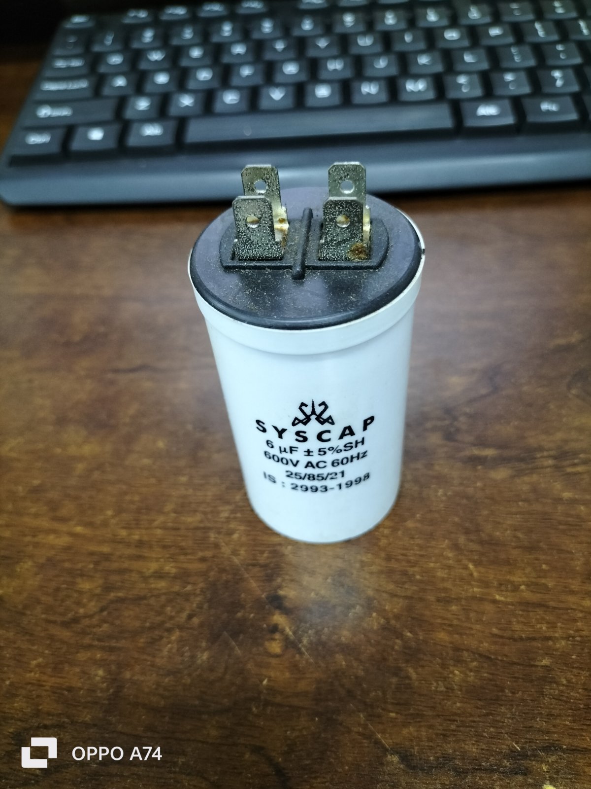 Syscap Motor Capacitor for electrical circuitry applications, featuring a durable white casing with connectors
