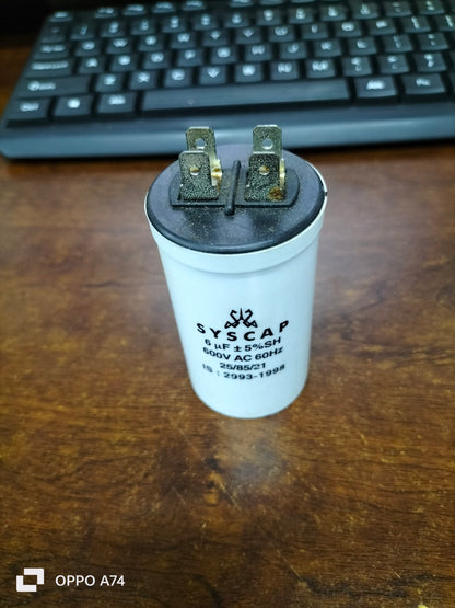 Syscap Motor Capacitor for electrical circuitry applications, featuring a durable white casing with connectors