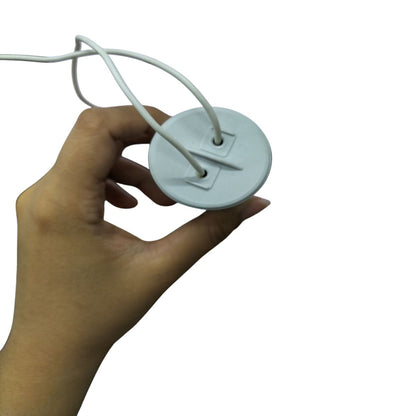 Hand holding SYSCAP Motor Running Capacitor 100MFD 450V AC electrical part with two white wires