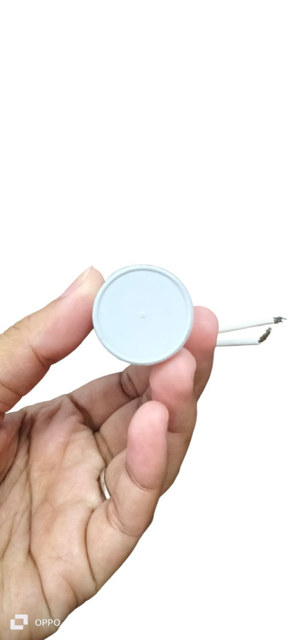 Syscap Motor Running Capacitor 14MFD 350V held in hand showing round white electrical component