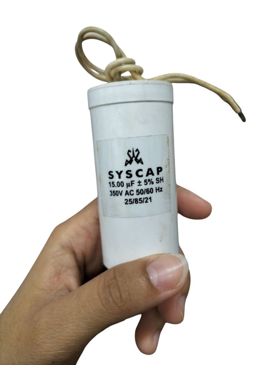 Syscap motor running capacitor 15mfd held in hand for electrical circuitry and parts