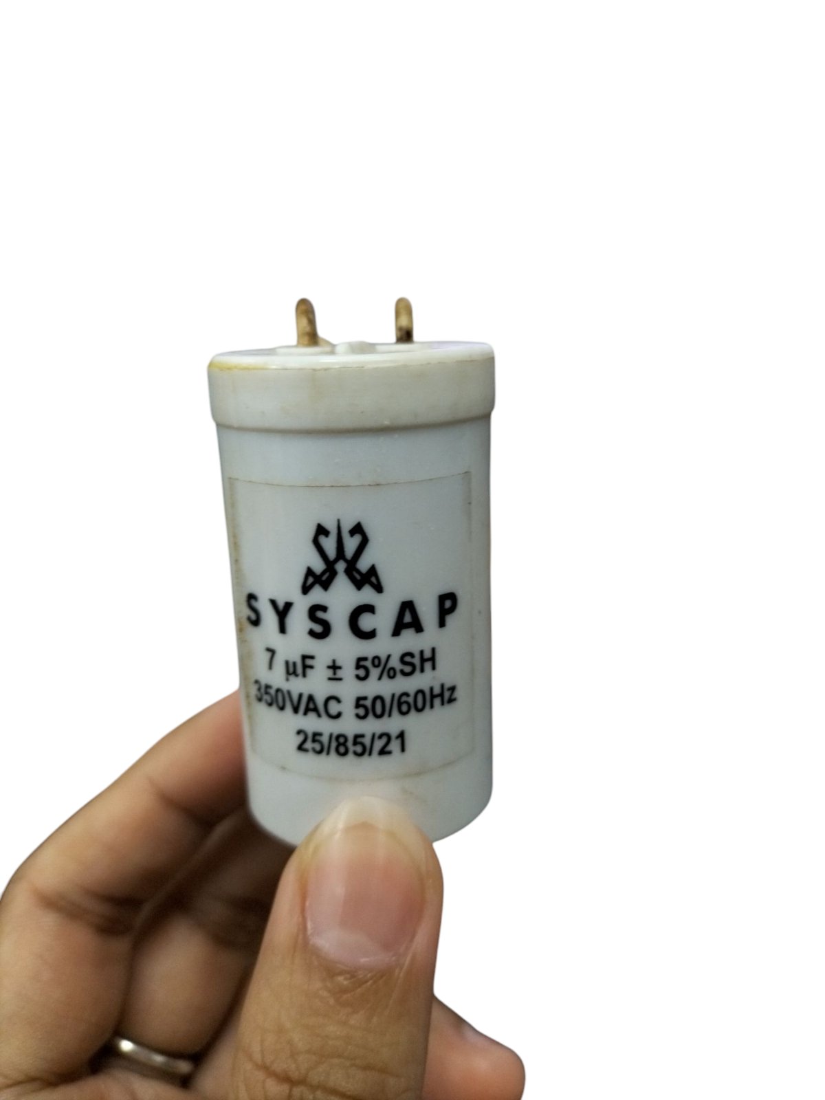 Syscap motor running capacitor 7uF 350V in hand, designed for efficient electrical performance