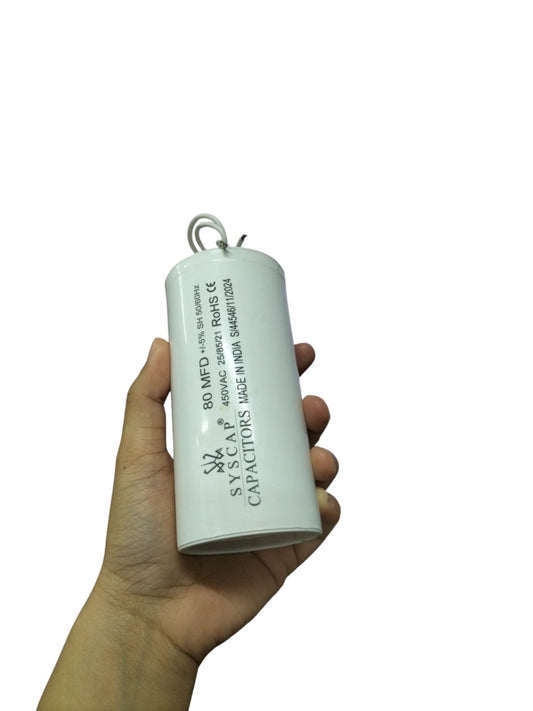 Hand holding SYSCAP Motor Running Capacitor 80MFD 450V AC electrical component for motors