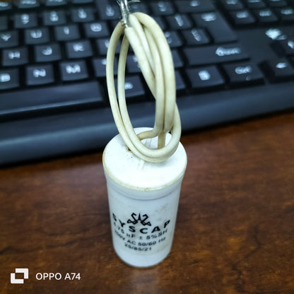 Syscap running capacitor 250V for motor with white casing and attached wires