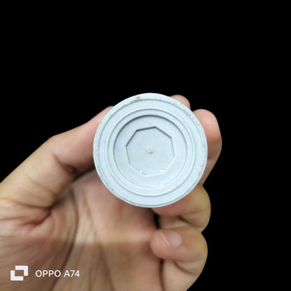 Hand holding a Running Capacitor 450VAC showing the base design and structure