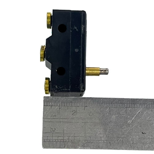 Tend Limit Switch 15A 250VAC TM1305 black micro switch with brass terminals and metal plunger shown next to ruler for scale