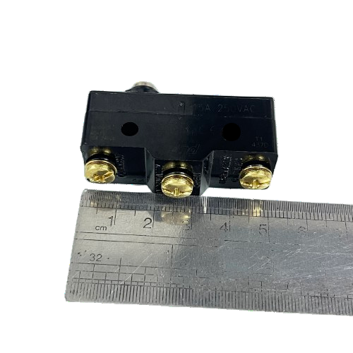 Limit Switch 15A 250VAC TM1306 Tend black plastic body with three brass screw terminals shown next to ruler for scale