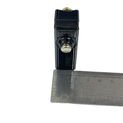 Limit Switch 15A 250VAC TM1306 Tend black plunger limit switch photographed next to ruler for scale
