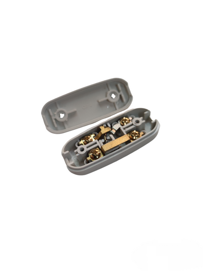 Omni Through Cord Switch 3A 250V with open gray plastic casing and internal brass connectors