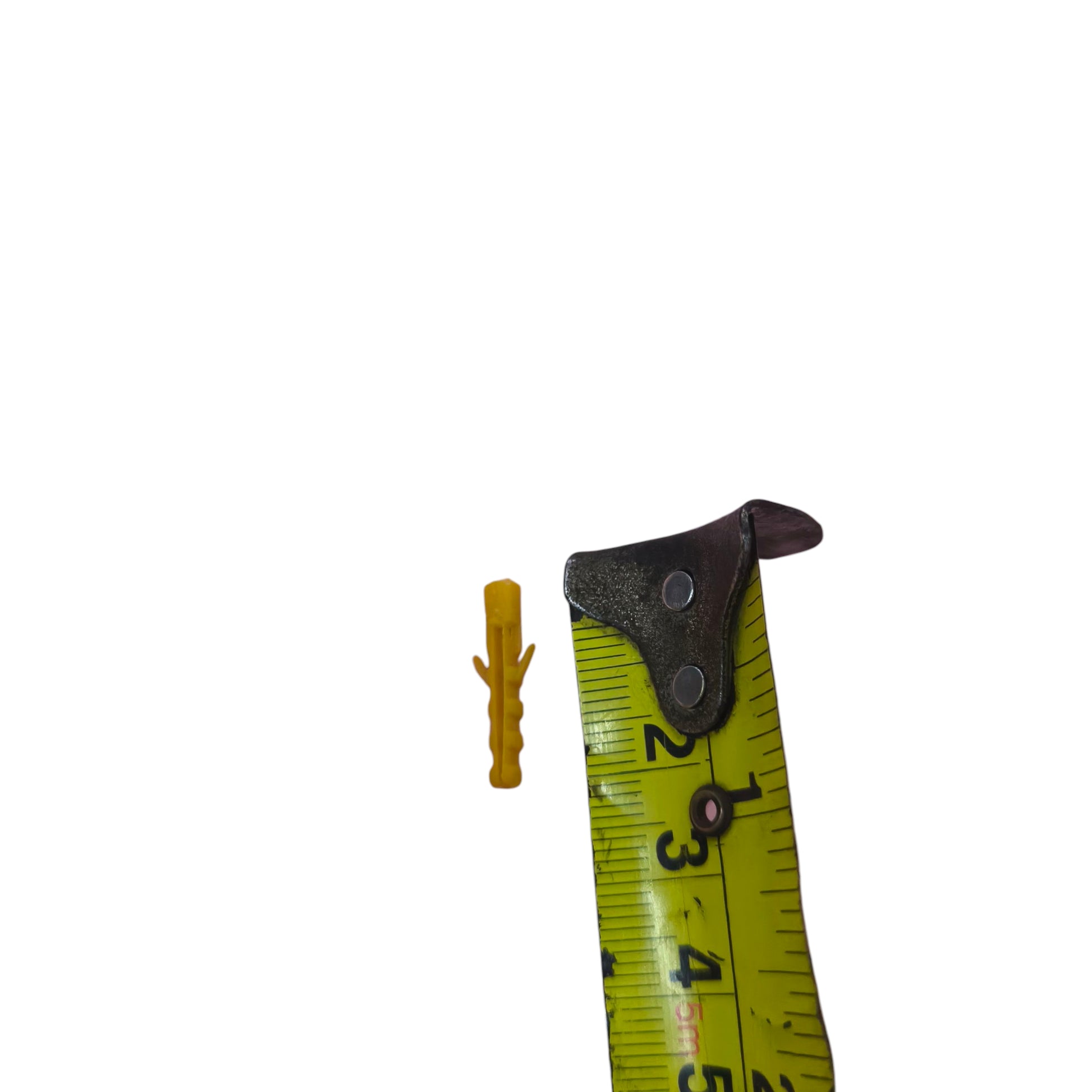 Yellow plastic wall anchor Tox 4mm x 2cm shown next to a tape measure indicating its 2 cm length