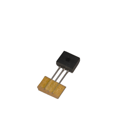 Transistor Different Kinds example showing a black rectangular transistor connected to a yellow circuit board piece