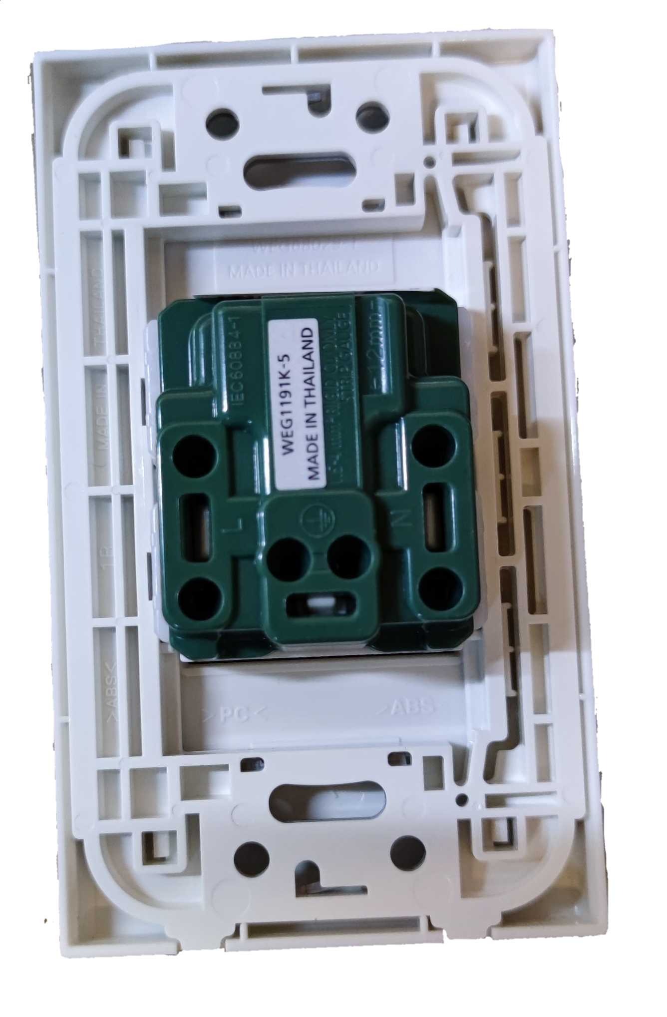 Panasonic 250V quick connect electrical socket green insert mechanism mounted in white wall plate frame