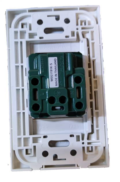 Panasonic 250V quick connect electrical socket green insert mechanism mounted in white wall plate frame