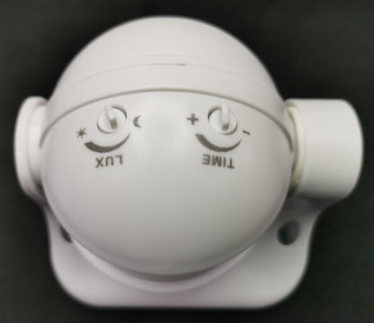White dome PIR Motion Sensor 5A 220V with lux and time adjustment knobs and swivel mounting bracket