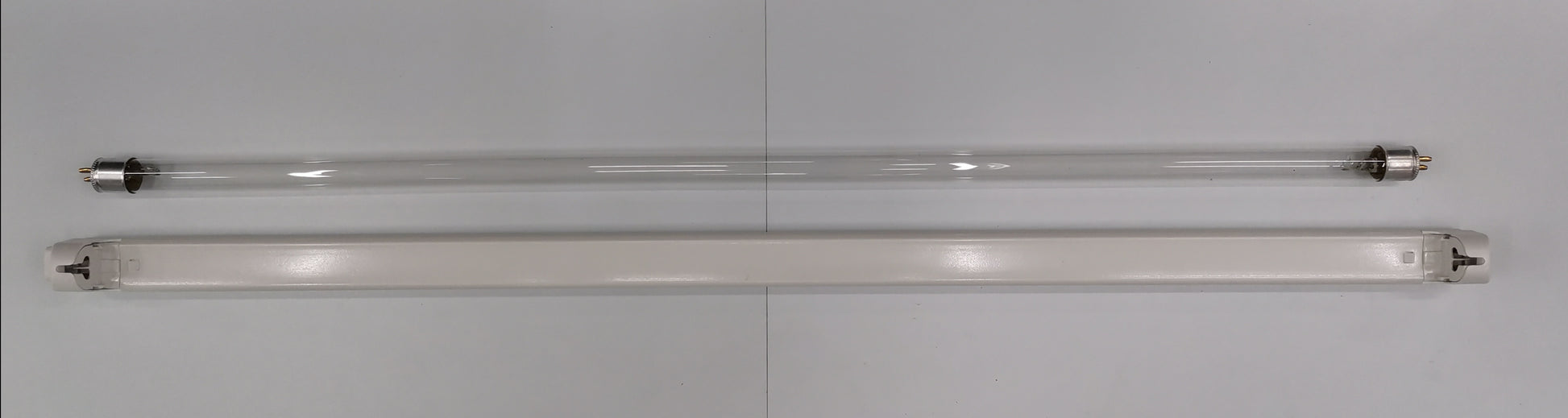Philips UVC T5 fluorescent lamp 14 watt next to a clear tube for effective UV light solutions