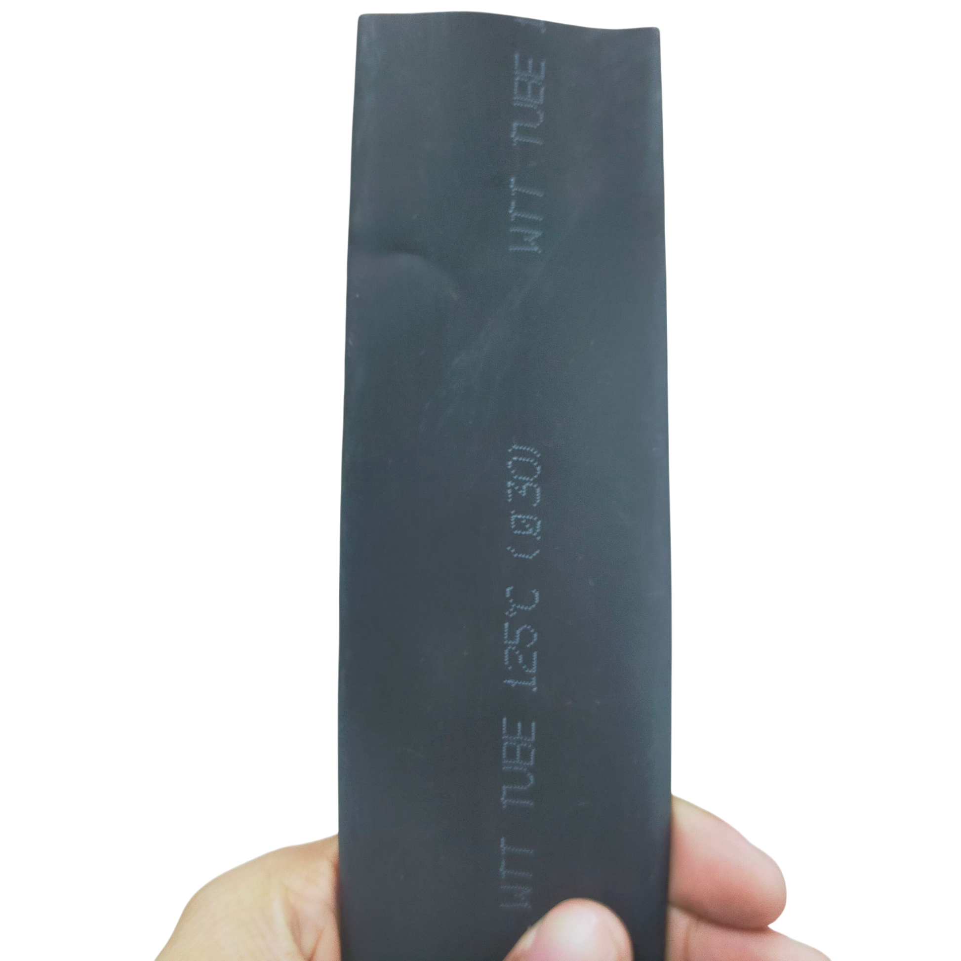 Hand holding 30mm Shrinkable Tube Black. Heat shrink sleeve for cable management with embossed markings