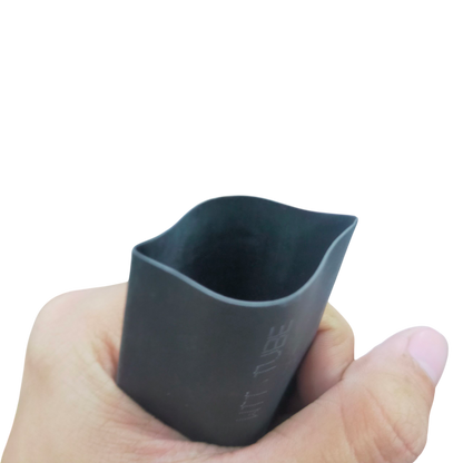 Hand holding molded 30mm Shrinkable Tube Black cable management sleeve for wires and cords